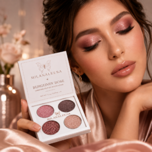 Model holding Milanaleesa Burgundy Rose glitter eyeshadow palette