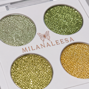Close-up of four Olive Gold glitter eyeshadow shades